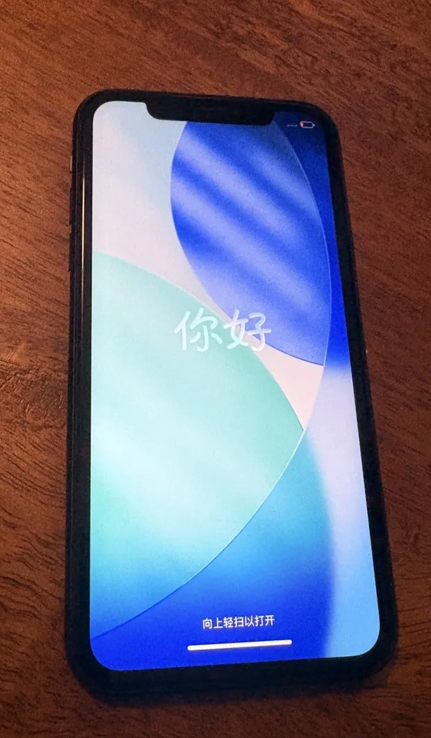 A traded-in iPhone 13, photographed on the bench the day it arrived