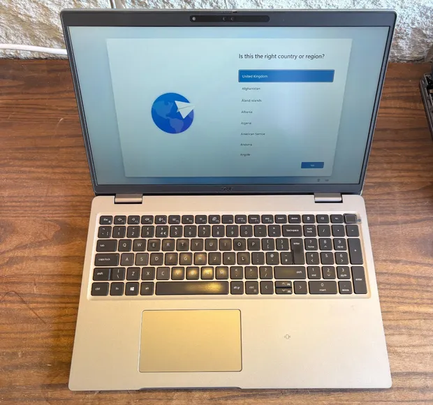 A traded-in MacBook Air, lid open, photographed on arrival
